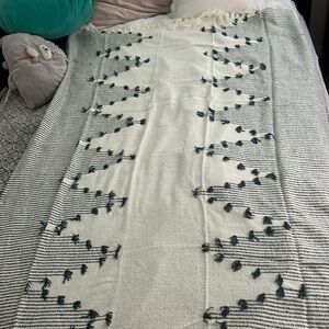 A boho-themed throw blanket is a stylish and cozy addition to your home decor.